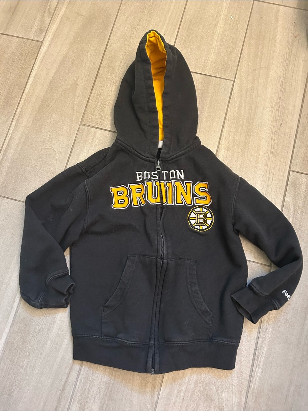 Reebok Kids Black Hoodie with Yellow hood Lining and Bruins Logo